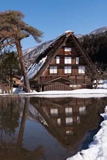 The reflection of traditional house in Shirakawa-go village, Japan The reflection of traditional house in Shirakawa-go village, Japan