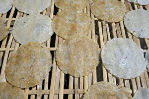 Rice cakes drying on a bamboo frame, Bali, Indonesia Rice cakes drying on a bamboo frame, Bali, Indonesia