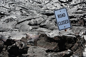 Road closed, a sign on a lava field in the eastern rift zone, Kilauea volcano, Big Island Road closed, a sign on a lava field in the eastern rift zone, Kilauea volcano, Big Island