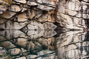 Rocky cliffs reflected in the calm waters of Horseshoe Lake, Jasper National park Rocky cliffs reflected in the calm waters of Horseshoe Lake, Jasper National park