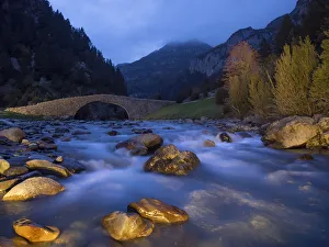 Roman bridge on a river of high mountain in autumn Roman bridge on a river of high mountain in autumn