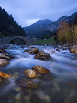 Romanesque bridge on a river of high mountain Romanesque bridge on a river of high mountain