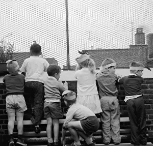 <b class=qtipBold><figcaption>Roof View</figcaption></b><br>Children looking out from the rooftop playground of the Jones Centre of the Children's Aid Society in New York City. Roof View