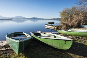 Rowing boats on the shore of Hopfensee Lake near Fuessen, Ostallgaeu region, Allgaeu Rowing boats on the shore of Hopfensee Lake near Fuessen, Ostallgaeu region, Allgaeu