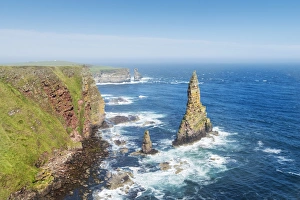 Rugged coastal landscape with the Duncansby Stacks, rock pinnacles, at Duncansby Head Rugged coastal landscape with the Duncansby Stacks, rock pinnacles, at Duncansby Head