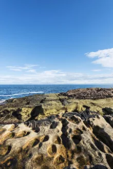 Rugged coastline with eroded sandstone on the Moray Firth at Tarbat Ness, Scotland Rugged coastline with eroded sandstone on the Moray Firth at Tarbat Ness, Scotland