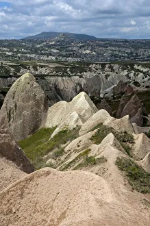 Rugged landscape with weathered tuff formations, Rose Valley, Goreme National Park Rugged landscape with weathered tuff formations, Rose Valley, Goreme National Park