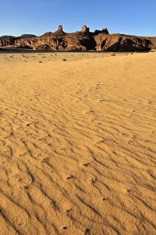 Sandstone rock formation and dunes on Tasset Plateau, Tassili n'Ajjer National Park, Unesco World Heritage Site Sandstone rock formation and dunes on Tasset Plateau, Tassili n'Ajjer National Park, Unesco World Heritage Site