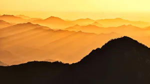<b class=qtipBold><figcaption>Sanqing Mountain</figcaption></b><br>This image was taken in Sanqing Mountain, China around sunrise. The layers of mountains were exposed under beautiful light.<br><em>© MEI XU</em> Sanqing Mountain