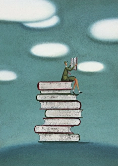Schoolboy Sitting on a Stack of Books Reading Schoolboy Sitting on a Stack of Books Reading