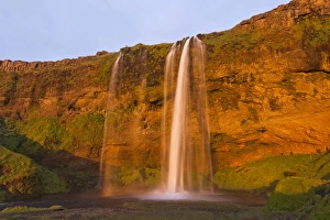 Seljalandsfoss waterfall in the evening light, Seljalandsfoss, Iceland Seljalandsfoss waterfall in the evening light, Seljalandsfoss, Iceland
