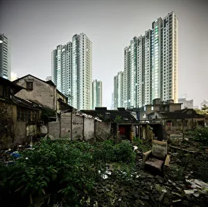 <b class=qtipBold><figcaption>Shanghai contrast old / new</figcaption></b><br>A demolition area in Shanghai. In the foreground are debris of old houses. In the decay still present building remnants live the last ancient inhabitants until these buildings to be demolished for new building space to create. In the background grow the new residence in the sky.<br><em>© 2013 Steffen Schnur</em> Shanghai contrast old / new