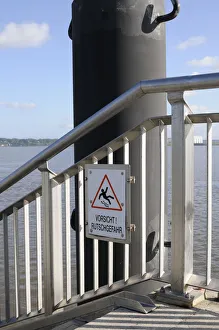A sign Vorsicht Rutschgefahr, German for caution, slip hazard at the Hamburg harbour A sign Vorsicht Rutschgefahr, German for caution, slip hazard at the Hamburg harbour