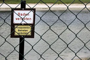 Two signs Baden verboten and Privatgrundstueck, Betreten verboten, German for Bathing prohibited and Private property Two signs Baden verboten and Privatgrundstueck, Betreten verboten, German for Bathing prohibited and Private property