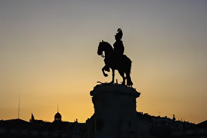 Silhouette of the equestrian statue of Jose I at sunset, Praca do Comercio, Lisbon, Portugal Silhouette of the equestrian statue of Jose I at sunset, Praca do Comercio, Lisbon, Portugal