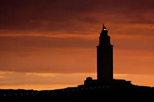 A Coruna Gallery: Silhouette of Hercules Tower at orange sunset