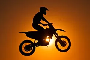 Images Dated 7th March 2012: Silhouette of motocross at sunset