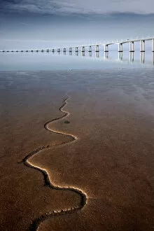 Images Dated 18th January 2009: Snake like stream flowing to river with bridge