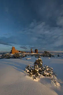Snow covered landscape and reaching clouds near Balanced Rock, Arches National Park, Utah Snow covered landscape and reaching clouds near Balanced Rock, Arches National Park, Utah