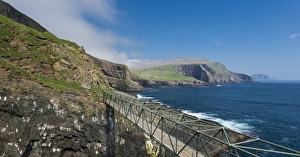 So-called Atlantic Bridge between Mykines and Mykinesholmur, rocky coast of Mykines So-called Atlantic Bridge between Mykines and Mykinesholmur, rocky coast of Mykines