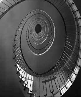 <b class=qtipBold><figcaption>Spiral Staircase</figcaption></b><br>10th May 1951: A view up through the centre of a spiral staircase. (Photo by Harry Shepherd/Fox Photos/Getty Images)<br><em>© This content is subject to copyright.</em> Spiral Staircase