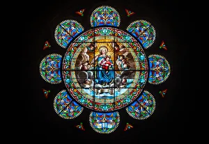 Stained Glass Rose Window featuring the Virgin Mary and her son Jesus Christ in the Stained Glass Rose Window featuring the Virgin Mary and her son Jesus Christ in the