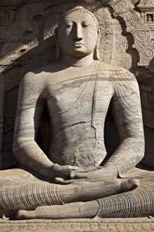 North Central Province Gallery: Statue of a sitting Buddha attached to the rock