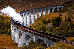 Images Dated 20th September 2019: Steam train crossing the Glenfinnan bridge with autumn colors in Scotland