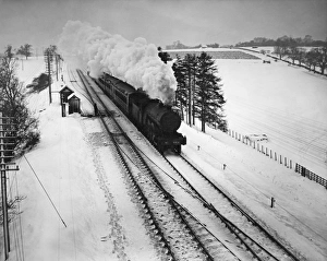 <b class=qtipBold><figcaption>Steam Train In Snow</figcaption></b><br>A London and North Eastern Railway (LNER) steam locomotive hauling a passenger train 1938. (Photo by Fox Photos/Hulton Archive/Getty Images)<br><em>© 2012 Getty Images</em> Steam Train In Snow