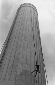 <b class=qtipBold><figcaption>Steeplejack</figcaption></b><br>Steeplejack Harry Walker spending his honeymoon on a rush job, painting the chimney stack at Battersea Power station. (Photo by Keystone/Getty Images) Steeplejack