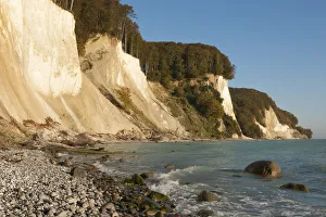 Stone beach, chalk cliffs and a beech forest, Jasmund National Park, Ruegen, Mecklenburg-Western Pomerania, Germany Stone beach, chalk cliffs and a beech forest, Jasmund National Park, Ruegen, Mecklenburg-Western Pomerania, Germany