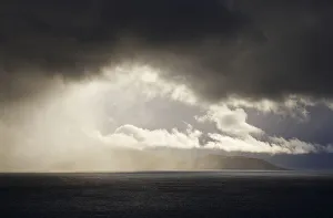 <b class=qtipBold><figcaption>Stormy skies</figcaption></b><br>A storm brews over West Point Island<br><em>© Ben Cranke</em> Stormy skies
