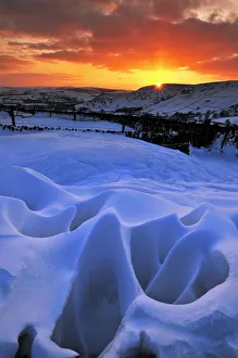 Strange natural snow formations at sunset with the Derbyshire countryside. UK Strange natural snow formations at sunset with the Derbyshire countryside. UK