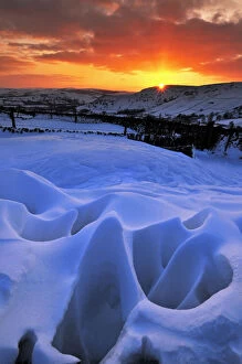 Images Dated 9th January 2010: Strange natural snow formations at sunset with the Derbyshire countryside. UK