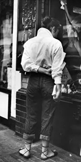Street Fashion 1953; fashionable young woman window shopping in London's Piccadilly Street Fashion 1953; fashionable young woman window shopping in London's Piccadilly