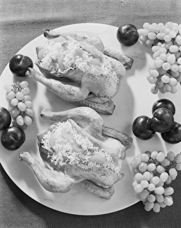 Stuffed chicken and fruits in plate, close-up Stuffed chicken and fruits in plate, close-up