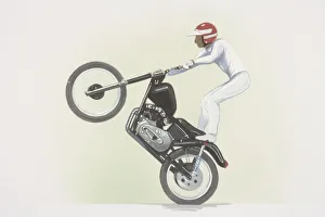Stunt rider standing on motorbike, front wheel raised, side view Stunt rider standing on motorbike, front wheel raised, side view