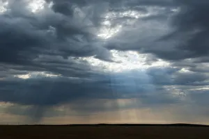 Sunlight breaking through dark clouds near Minuteman nuclear missile site, South Dakota Sunlight breaking through dark clouds near Minuteman nuclear missile site, South Dakota