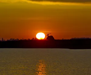 Sunrise with drawing well at Darscho-Lacke or Warmsee Lake, Seewinkel, Apetlon Sunrise with drawing well at Darscho-Lacke or Warmsee Lake, Seewinkel, Apetlon