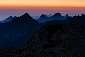 Sunrise above the peaks of the Allgau Alps in steplike arrangement, Oberstdorf, Bavaria Sunrise above the peaks of the Allgau Alps in steplike arrangement, Oberstdorf, Bavaria