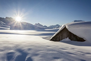 Sunrise on Sennes Alm at the Sennes refuge in the Fanes-Sennes-Prags Nature Park in the Dolomites Sunrise on Sennes Alm at the Sennes refuge in the Fanes-Sennes-Prags Nature Park in the Dolomites