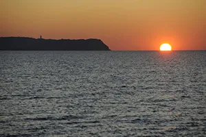 Sunset over the Baltic Sea beside Hiddensee Island with Dornbusch lighthouse, Hiddensee, Mecklenburg-Vorpommern Sunset over the Baltic Sea beside Hiddensee Island with Dornbusch lighthouse, Hiddensee, Mecklenburg-Vorpommern