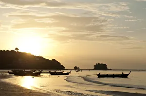 Sunset at the beach, fishing boats in silhouette, Nai Yang Beach, Phuket, Phuket Province Sunset at the beach, fishing boats in silhouette, Nai Yang Beach, Phuket, Phuket Province