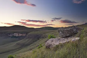 Sunset over Drakensberg mountains with orange, pink and blue - Giants Castle South Africa Sunset over Drakensberg mountains with orange, pink and blue - Giants Castle South Africa