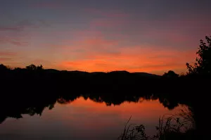 Sunset over still lake in the Kruger National Park, Mpumalanga, South Africa