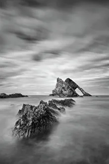Sunset with smooth water at bow fiddle rock near Portknockie - Scotland Europe