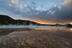Sunset with steam rising from Grand Prismatic Spring, Yellowstone National Park, Wyoming Sunset with steam rising from Grand Prismatic Spring, Yellowstone National Park, Wyoming