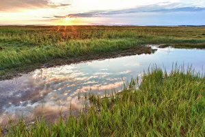 Sunset over tidal marsh at Massachusetts Audubons Wellfleet Bay Wildlife Sanctuary, Wellfleet, Cape Cod, Massachusetts Sunset over tidal marsh at Massachusetts Audubons Wellfleet Bay Wildlife Sanctuary, Wellfleet, Cape Cod, Massachusetts
