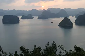 Sunset in the UNESCO-declared world natural heritage Halong Bay Viet Nam Sunset in the UNESCO-declared world natural heritage Halong Bay Viet Nam