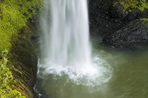 Surge of water falling into a lake, Bridal Veil Falls, Raglan, Waikato, North Island Surge of water falling into a lake, Bridal Veil Falls, Raglan, Waikato, North Island